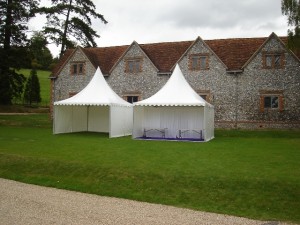 Two 5m x 5m pagoda style marquees being used for satellite food and bar areas at a private function