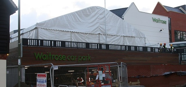 A marquee being used as a car park cover to enable the car park surface to be applied.